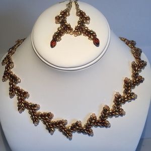 Handmade beaded necklace and matching drop earrings set.